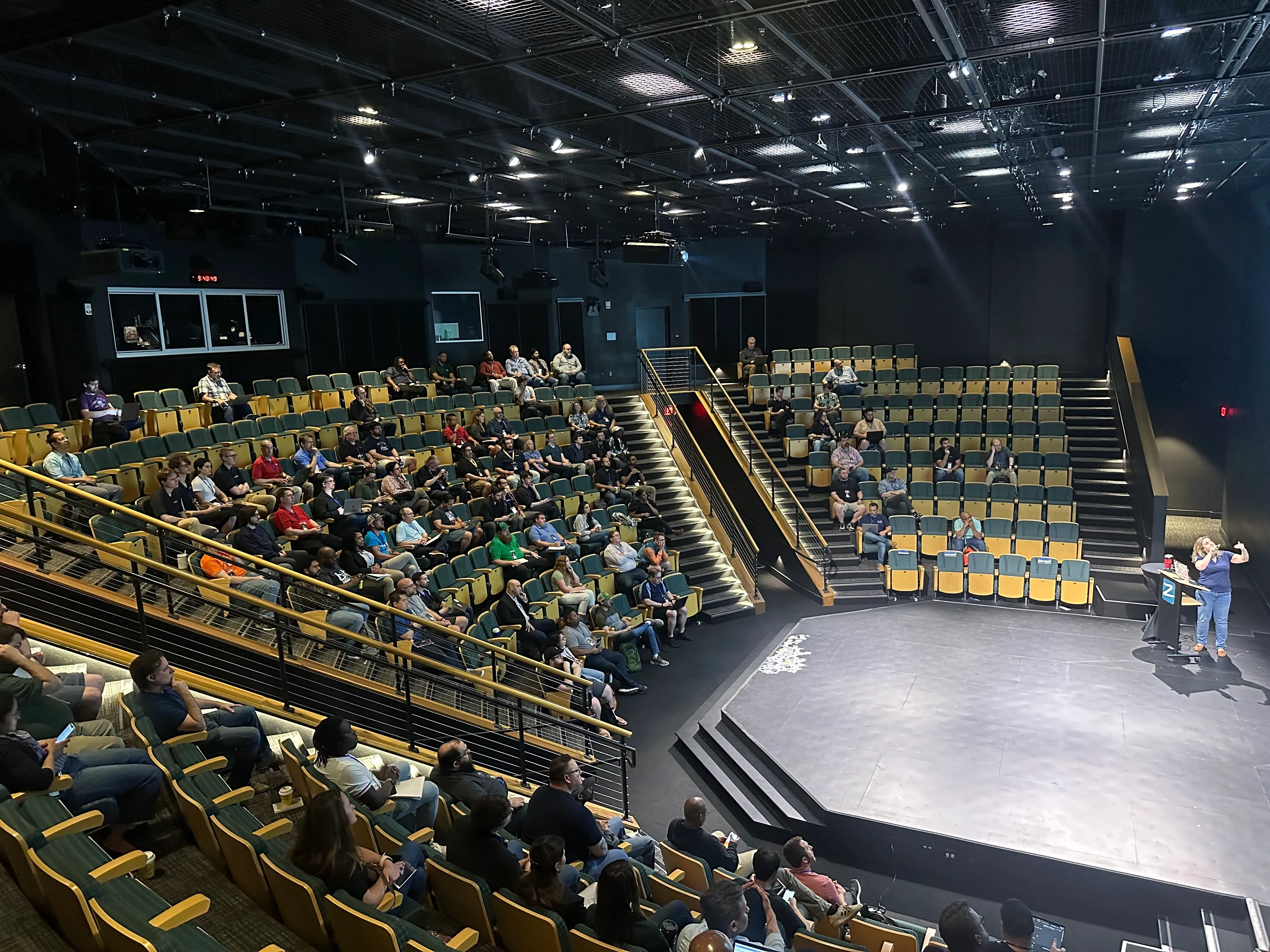 Full auditorium showing strong attendance