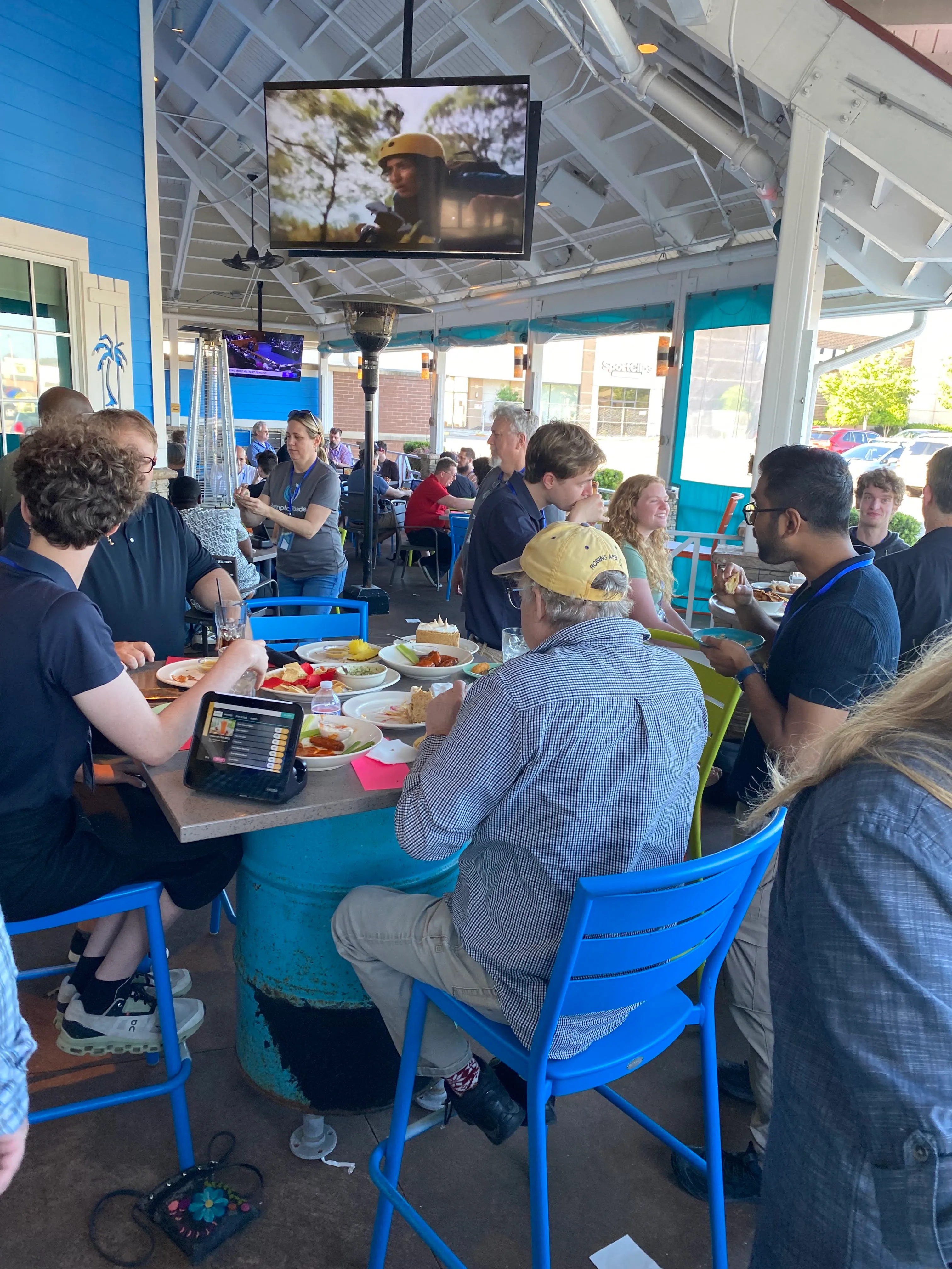Outdoor networking area with attendees